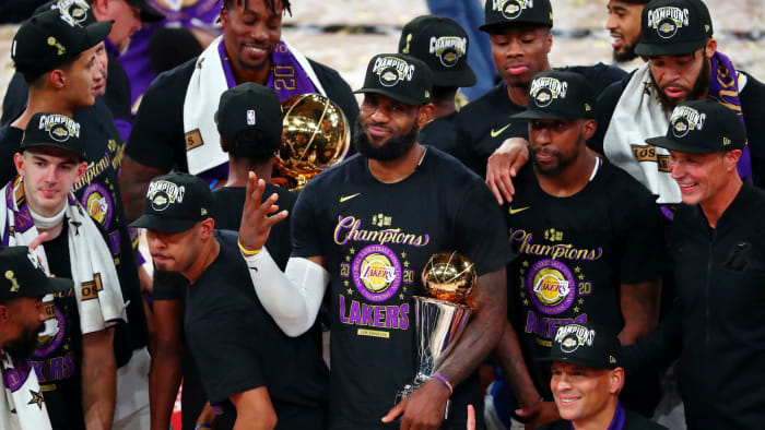 Los Angeles Lakers forward LeBron James (23) holds up four fingers after winning his fourth NBA championship after game six of the 2020 NBA Finals at AdventHealth Arena. The Los Angeles Lakers won 106...